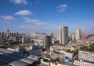 a view of a city with tall buildings at Sun Moon Lake Hotel Dalian in Dalian