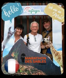 a picture of three people and a sign with giraffes at Taytaypa Rooms & Apartments Lima Airport in Lima