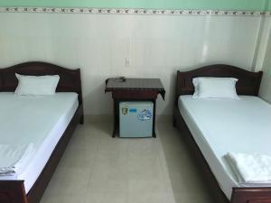 Lova arba lovos apgyvendinimo įstaigoje Anh Linh Guest House