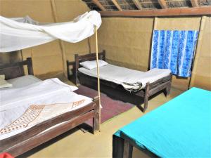 Ein Bett oder Betten in einem Zimmer der Unterkunft Royal Tiger Cottage