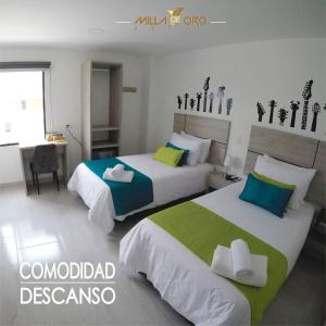Postel nebo postele na pokoji v ubytování Hotel Milla de Oro Uraba