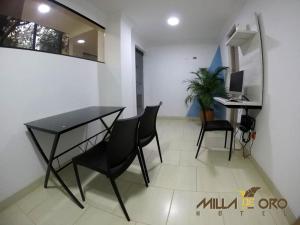 TV a/nebo společenská místnost v ubytování Hotel Milla de Oro Uraba