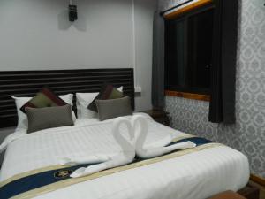 Postel nebo postele na pokoji v ubytování Pai Iyara Resort