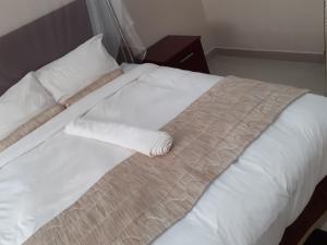 Postel nebo postele na pokoji v ubytování Delight Lodge