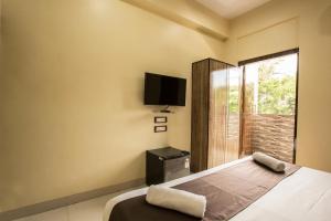Ένα ή περισσότερα κρεβάτια σε δωμάτιο στο Hotel Apsara- Near J J Hospital Mumbai