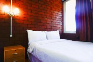 Ένα ή περισσότερα κρεβάτια σε δωμάτιο στο Pruksatara Garden +26 φωτογραφίες