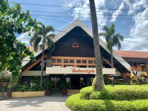 a building with a sign on the front of it at Maharajah Hotel in Angeles