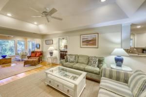 a living room with a couch and a table at Inlet Cove 12 in Kiawah Island +35 photos