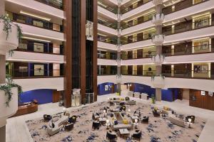 an overhead view of a large lobby with couches and tables at voco Al Khobar, an IHG Hotel in Al Khobar