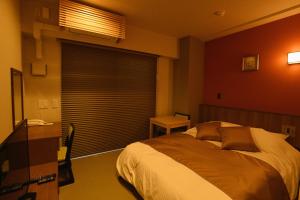 Hotel Imari Aioibashi Bettei客房内的一张或多张床位