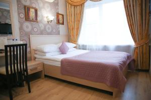 
Кровать или кровати в номере СеверСити гостиница 
