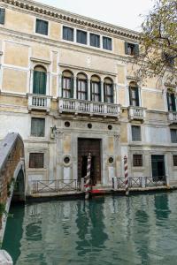 a building next to a body of water at Ca' Vendramin Zago in Venice