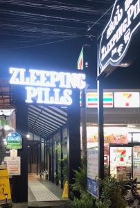 a shopping mall with a sign on the side of it at Zleepingpills Aonang Krabi in Krabi town