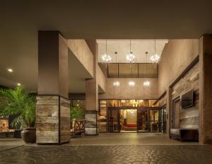 a lobby of a building with chandeliers at Crowne Plaza Phoenix Airport - PHX by IHG in Phoenix