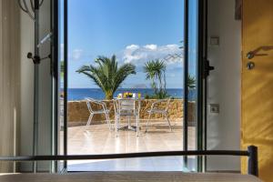 a view of the ocean from the door of a house at Pachia Ammos Falasarna in Falasarna