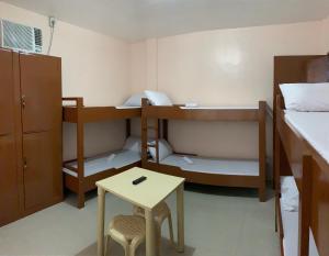 Postel nebo postele na pokoji v ubytování Brielles Travellers Inn