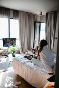 Postel nebo postele na pokoji v ubytování One Suite Hotel