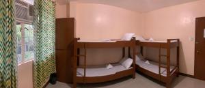 Postel nebo postele na pokoji v ubytování Brielles Travellers Inn