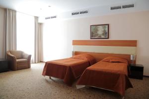 Кровать или кровати в номере Отель Митино