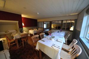 a dining room with tables and chairs in a restaurant at The Marlborough in Marlborough