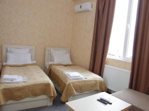 Voodi või voodid majutusasutuse Hotel Shalimar toas