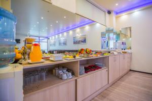 a kitchen with a lot of food on display at Hotel Aris in Sofia