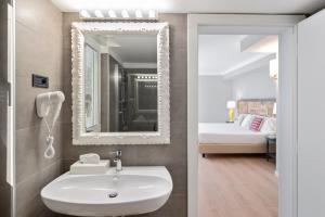 Koupelna v ubytování Hotel Leon d'Oro
