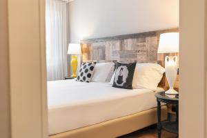 Postel nebo postele na pokoji v ubytování Hotel Leon d'Oro