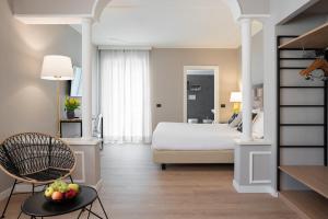 Postel nebo postele na pokoji v ubytování Hotel Leon d'Oro