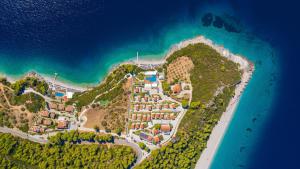 an aerial view of a resort on a hill next to the ocean at Adrina Beach Hotel in Panormos Skopelos