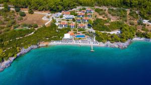 an aerial view of a resort on an island in the water at Adrina Beach Hotel in Panormos Skopelos