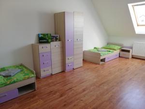 Posteľ alebo postele v izbe v ubytovaní Ubytování v podkroví