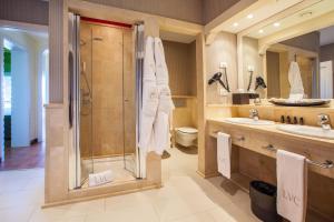 a bathroom with a shower and a sink at Lopesan Villa del Conde Resort & Thalasso in Meloneras