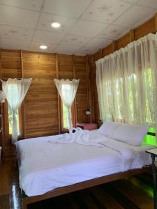 Ein Bett oder Betten in einem Zimmer der Unterkunft Sano Houes