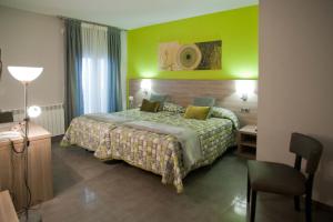 Postel nebo postele na pokoji v ubytování Hotel Victor