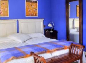 A bed or beds in a room at La Casona del Pastor