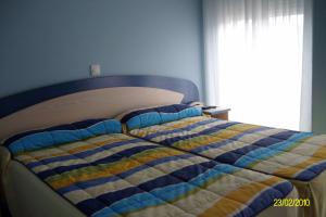 Cama o camas de una habitación en Hospedaje Argoños