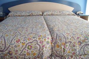 Katil atau katil-katil dalam bilik di Hospedaje Argoños