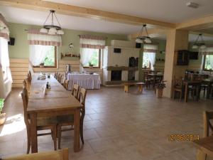 a large dining room with a table and chairs at Chata Sudecka in Sienna