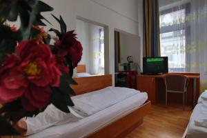 เตียงในห้องที่ City Lounge Hotel Oberhausen