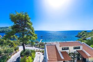 an aerial view of a house and the ocean at Adrina Beach Hotel in Panormos Skopelos