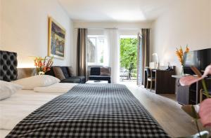 Postel nebo postele na pokoji v ubytování Dom Hotel