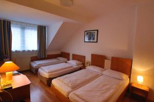 En eller flere senger på et rom på City Lounge Hotel Oberhausen