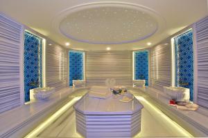 a room with a table and two chairs and a ceiling at Oran Hotel in Istanbul