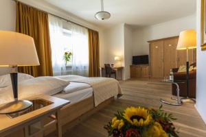Postel nebo postele na pokoji v ubytování Dom Hotel
