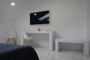TV a/nebo společenská místnost v ubytování Patio di Fiori