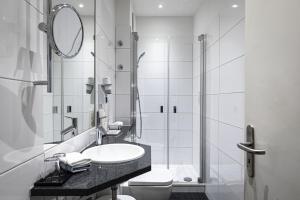 Koupelna v ubytování Dom Hotel