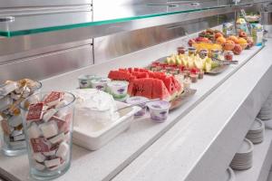 a buffet line with a lot of food on it at Adrina Beach Hotel in Panormos Skopelos
