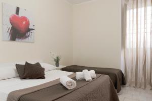 A bed or beds in a room at Al Colosseo 8