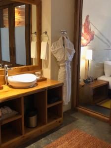 a bathroom with a sink and a mirror at The Postcard Dewa, Thimphu, Bhutan in Thimphu